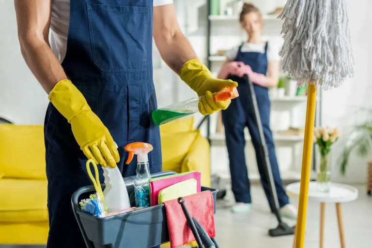 A man holding the cleaning tools ready to clean the house.